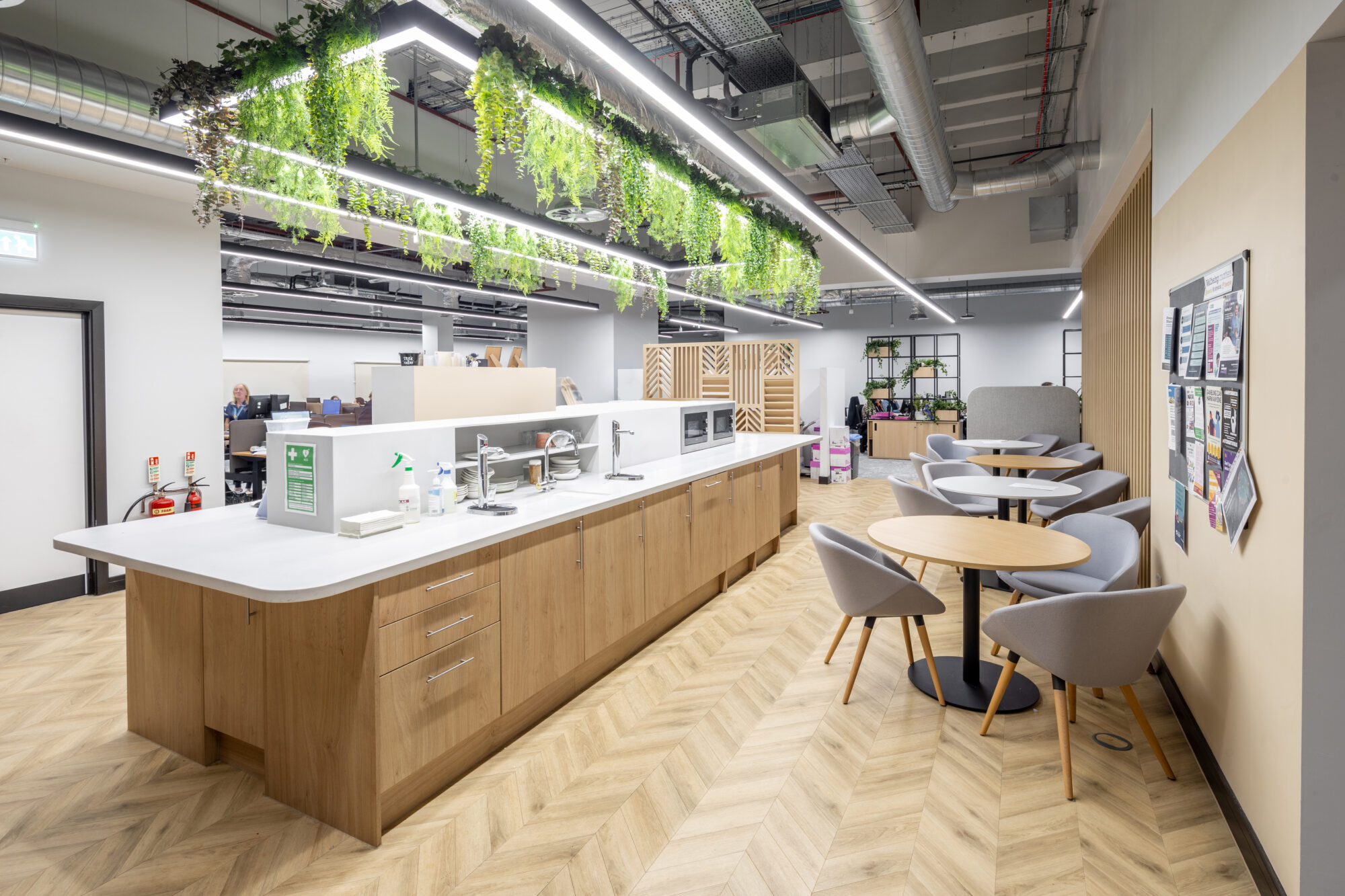 Modern island kitchen and communal area for staff